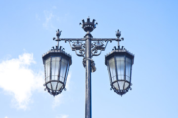 Fototapeta na wymiar Typical classic portuguese streetlight against a blue sky
