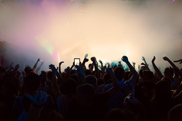 Obraz na płótnie Canvas silhouettes of a crowd party concert music happy