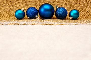 Blue christmas balls isolated .