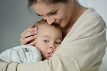 Fototapeta na wymiar Mom breast feeding baby girl