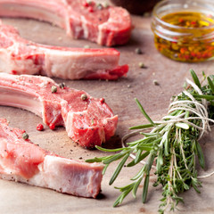 Raw meat, mutton, lamb rack on a wooden background
