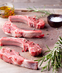 Raw meat, mutton, lamb rack on a wooden background