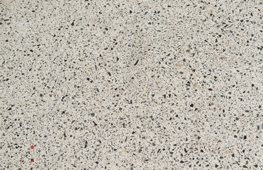 Texture of little stones are blocked in concrete