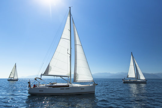 Fototapeta Sailing regatta. Sailing in the wind through the waves. Luxury yachts.