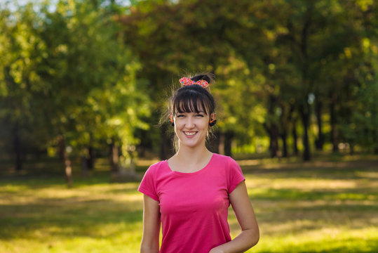 a woman jogging in the park in early morning