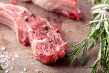Raw meat, mutton, lamb rack on a wooden background
