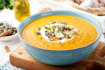 Roasted pumpkin and carrot soup with cream .  - 94504353