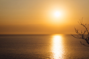 Fototapeta na wymiar Orange sunrise over the sea