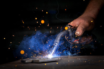 Worker welding theiron