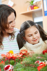 Happy young family getting ready for the Advent, Christmas holid