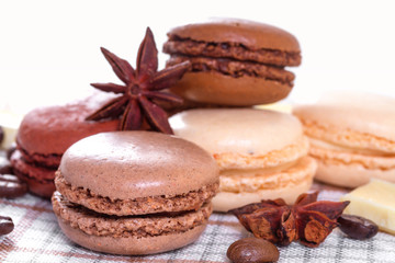 Chocolate macaroons with anise stars