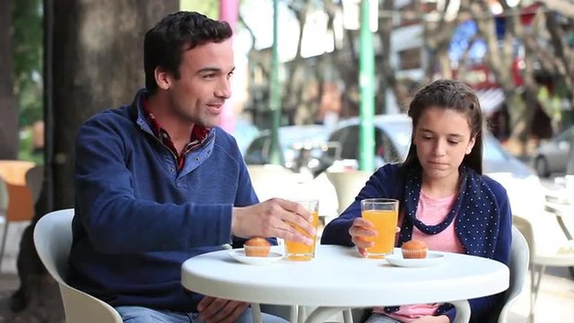 Man with a girl in a coffee