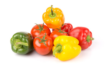 Group of sweet vegetables: yellow, orange, green, red paprika and freshness tomatoes on white isolated background.