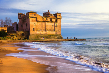 castle over sea and sunset. Santa Severa, Italy