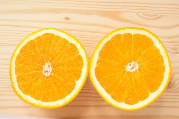 Sliced orange on wooden background