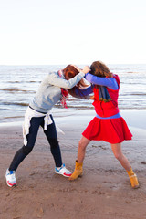 Fototapeta premium Fighting women near lake