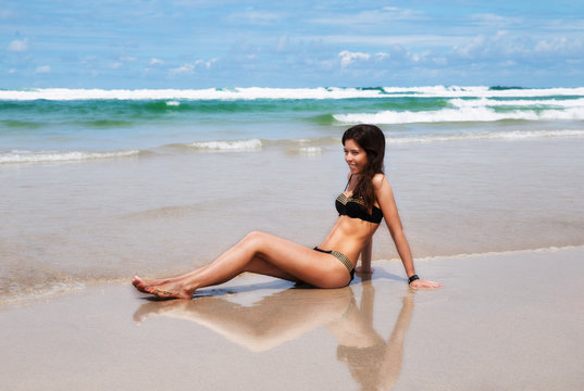 Young pretty woman on a beach