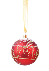 Red Christmas decoration hanging on ribbon