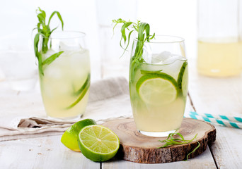 Lime cucumber lemonade cocktail on a white table