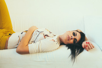 Lady resting on the couch