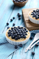 Homemade blueberry tart on blue wooden table