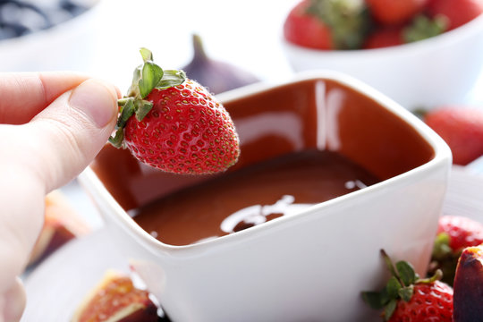 Chocolate fondue with fresh berries, close up