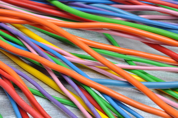 Colored electrical cables on metal surface