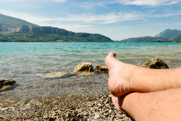 feet on the beach of lake of Annecy