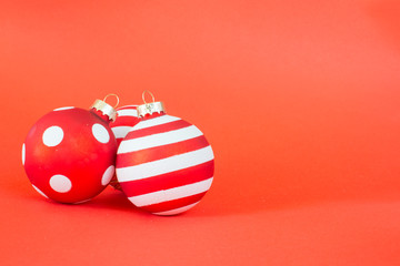 Beautiful christmas balls on red background