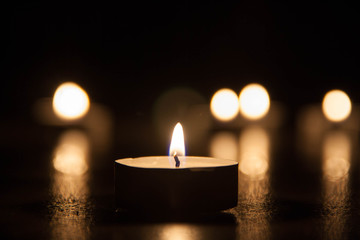 Lit Candle on the flor