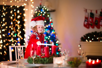 Fototapeta na wymiar Child at family Christmas dinner at home