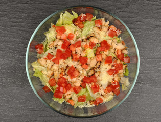 Caesar salad in a transparent bowl
