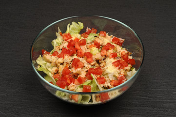 Caesar salad in a transparent bowl
