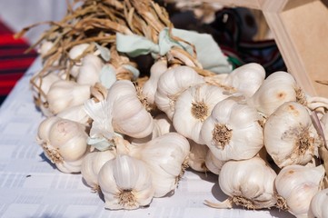 Heap of fresh organic garlics in a market place