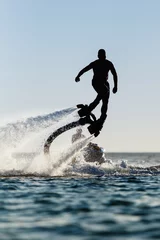 Acrylic prints Water Motor sports Silhouette of a fly board rider