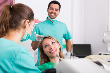 Portrait of dentist and patient at dental clinic