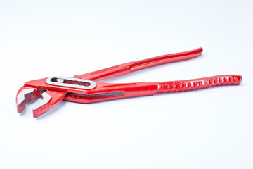 Close up new universal alligator spanner tool on white background