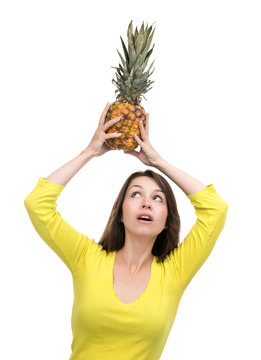 Caucasian woman hold Pineapple fruit smiling healthy and joyful