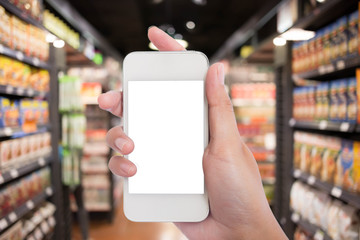 Women in shopping mall using mobile phone.