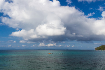 tropical sea and sky with clouds
