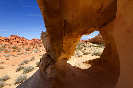 Desert landscape framed by red rock formation, Valley of Fire State Park, Navada