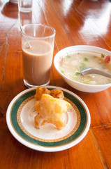 Rice Porridge served with deep-fried dough stick and hot cocoa