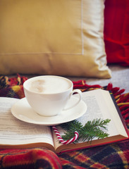 Cup of coffee and book