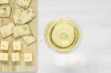 White wine with cheese and snacks
