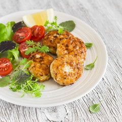 chicken cutlets and fresh vegetable salad