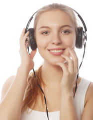 Fototapeta premium Woman with headphones listening music . Music teenager girl isol