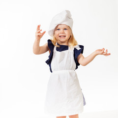 Nice little girl in costume of chef