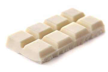White chocolate pieces isolated on white background