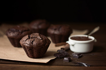 Chocolate muffins on the table, dark background  