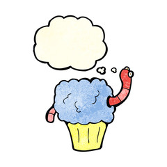 cartoon worm in cupcake with thought bubble